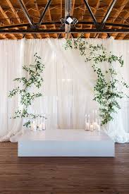 Rustic Draped Wedding Ceremony Backdrop With Modern Greenery And Candles Modern Ceremony Backdrop Wedding Ceremony Backdrop Wedding Ceremony Decorations