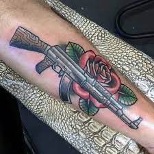 Guns are typically associated with policemen, bounty hunters, soldiers, hunters, criminals, and so on. 40 Guns And Roses Tattoo Designs For Men Hard Rock Band Ink Ideas