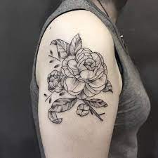 The meaning of the camellia flower is a vision of loveliness that takes one's breath away. 24 Beautiful And Elegant Camellia Tattoo Designs Tattoobloq Camellia Tattoo Flower Thigh Tattoos Tattoos