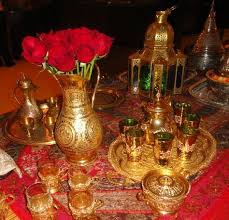 Middle eastern style and decorating theme is about fairy tale table decorations and centerpieces, blending festive table decorating ideas and traditional crochet crafts, modern decorating colors and golden or silver accents, glowing tea light candles in attractive wrought iron candle holders and moroccan lanterns, shine of glass beads and charming floral centerpieces with peonies and roses. 15 Middle Eastern Themed Party Ideas Arabian Nights Party Moroccan Party Arabian Party