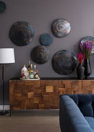 Are you having trouble deciding what size or type of wall decor to choose or how to hang pictures? Contemporary Gray Living Room Detail With Modern Credenza And Wall Art Hgtv