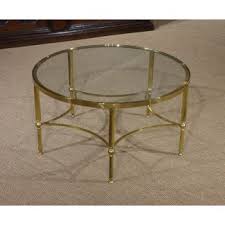 Pairs black glass with gleaming gold metal. Circular Glass Coffee Table You Ll Love In 2021 Visualhunt