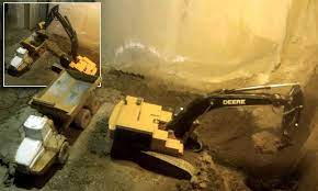 This video us digging a basement for a new construction. Man Excavates His Basement Using Nothing But Remote Controlled Construction Toys Daily Mail Online
