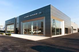 The New Dealership Of Vpe Pontoise Jaguar Landrover In The District Of Paris A New Car Dealership Was Metal Buildings Metal Building Homes Building Cladding