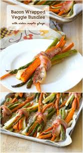 25 Delicious Christmas Side Dish Recipes To Take Along To Your Holiday Gatherings Side Dish Recipes Easy Christmas Side Dishes Bacon Wrapped Vegetables