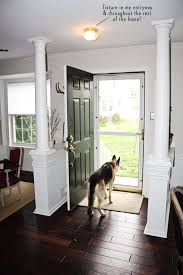 Interior Columns Flanking Front Door Okay I Could Do Without The Columns Maybe Ju Living Room Remodel Fireplace Furniture Arrangement Wood Walls Living Room