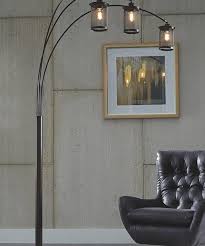 Illuminate The Room With The Adjustable Metal Arms Of This Floor Lamp Featuring Metal Mesh Shades For Industrial Inspired Perso Arc Floor Lamps Floor Lamp Lamp