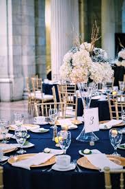 Navy And Gold Wedding Tablescape At The Old Cleveland Courthouse Gold Wedding Centerpieces Classic Wedding Decorations Navy Blue And Gold Wedding