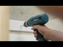 Trace around the cabinet while the assistant is holding it in. Cabinets Around The House How To Attach A Kitchen Cabinet To Concrete Walls Youtube