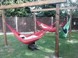Building a wood hammock stand will enhance the look of your yard and make for a great relaxation area. Family Hammock Stand Backyard Hammock Outdoor Hammock Hammock