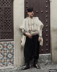 Algerian traditional dress is one of the most significant in north african region in the sense that it has maintained its original style. An Algerian In Traditional Clothes Beside One Of The House Of The Casbah A Historical Quarter In Algiers 1888 Colorization
