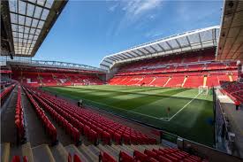Anfield is a football stadium in liverpool with a capacity of 45,522, and is home to liverpool f.c since their formation in 1892 although originally it was home of city rivals, everton between 1884 to 1892. Official Licensed Football Entertainment Wall Stickers Liverpool Fc Anfield Stadium Full Wall Mural Corner Image Of Stadium The Beautiful Game