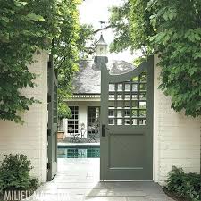 Custom Metal Garden Gates Uk Latticework Patterned Wooden Gates Which Open To A Pool And Pool House Con Garden Gate Design Garden Gates And Fencing Gate Design