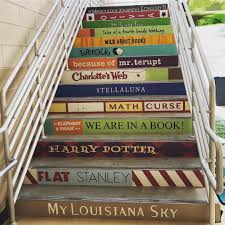 Classroomhoopla Stairs Painted With Book Titles Book Spines Iteachela Classroomdecor Schooldecor Painted Stairs Stair Art Painted Staircases