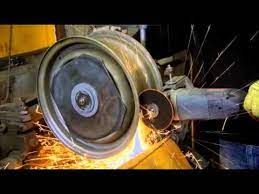 After looking at a bunch of stock cars. See How Steel Rims Are Widened Youtube