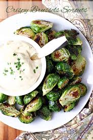 If you don't like a strong taste, blanch the sprouts in boiling water for 2 minutes and then run under cold water before cooking in the vegetable stock, but reduce the final cooking time. Crispy Brussels Sprouts With Mustard Aioli Let S Dish Recipes