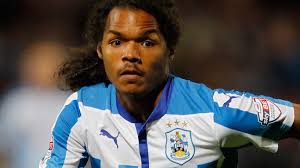 Duane Holmes: Bury sign Huddersfield midfielder