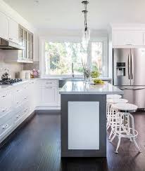 The trendy bar stool look a butcher block island with four exposed beams can be used to create a rustic and warm feel to the kitchen. White And Gray Kitchen Island With White Industrial Bar Stools Transitional Kitchen