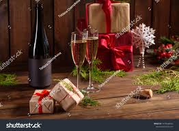 Christmas Holiday Table With Glasses And A Bottle Of Wine Of Champagne Eve Of New Year Preparation And Layin In 2020 Holiday Tables Christmas Holidays Christmas Wine