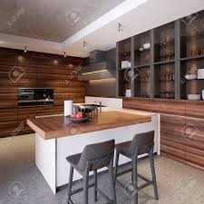 Modern kitchen with kitchen island with hood table with chairs. A Kitchen With A Kitchen Island With Two Chairs In A Modern Kitchen Stock Photo Picture And Royalty Free Image Image 113849279