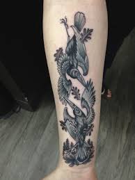 The diamond acts as a frame around the sunflower, and it looks as if the sunflower is coming out of the diamond. Crow On Red Rose Tattoo Design For Shoulder By Stefan Johnsson