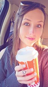 Dogs enjoying warm Texas sun under peach blossoms