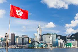 Hong Kong Flag Waving Over Blue Sky in ...