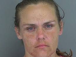 Woman carrying pill bottle filled with her urine arrested