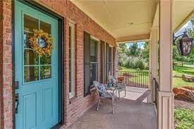 Match the color of the door to the trim of the house. Color Inspiration Teal Front Doors