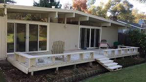 The low windows sparked the imaginations of children everywhere. A New Deck For An Old Mid Century Modern Home