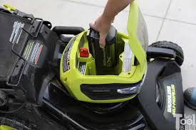 The ryobi electric riding lawn mower is delivered on a metal crate, covered in plastic that we had to cut away. Ryobi 40v Battery 21 Lawn Mower Review Her Tool Belt