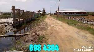 Residential plot of land with detached 2 storey concrete and wood home sitting on concrete foundation. For Sale Investment All Things Real Estate In Guyana