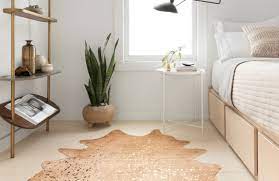 If the room itself is small, try a bedroom rug with stripes. Cowhide Rugs For Every Place In Your Home Rugs You Ll Love Lonny