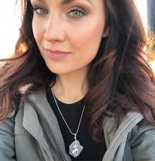 MEOW. My coworker Lisa (who works our assignment desk) walks up and down  Chicago beaches and collects cool pieces of glass. She then takes the glass  and turns it into funky jewelry!