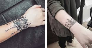 Black ink cross tattoo on wrist. 20 Stylish Bracelet Tattoo Ideas For Women Tattoo Blog