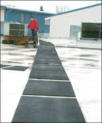 Installing gaco walk pads over there s2000 silicone waterproofing system. Roof Walkway Mats Provide Safe Rooftop Access For Maintenance