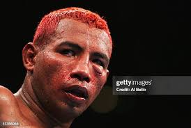 Corey Goodwin goes down after being hit by Elio Rojas during their... News  Photo