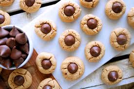 The combination of peanut butter and chocolate is amazing! Thumbprint Hershey Kiss Cookies Recipe The Anthony Kitchen