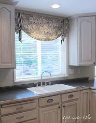 Some of your options include dressing each window separately, mounting your window coverings on the inside of the molding, or you can give plantation shutters a try. Kitchen Valance Idea Kitchen Window Coverings Kitchen Window Blinds Kitchen Window Treatments