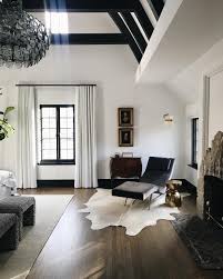 Modern Minimalist Master Bedroom With Cowhide Rug And Black Leather Chaise Lounge In 2020 Home Mediterranean Home Decor Minimalist Home