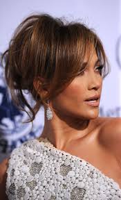 Low messy buns are one of those hairstyles that are great for any occasion. Jennifer Lopez Loose Bun Jennifer Lopez Hair Looks Stylebistro