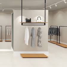 Decouvrez Nos Portants Suspendu Dore Noir Blanc Avec Etagere Effet Garanti Et Agencement De Mag Portant Vetement Bois Vitrine De Magasin De Vetements Design