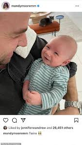 Maybe you would like to learn more about one of these? Mandy Moore Snaps A Cute Photo Of Her Baby Son Gus Sharing A Smile With His Father Taylor Goldsmith Daily Mail Online