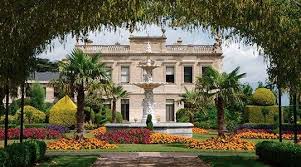 View Of Brodsworth Hall Through Laburnum Arch Across Colourful Summer Flower Beds South Yorkshire English Heritage Doncaster