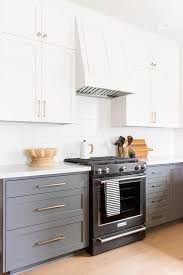 White Upper Cabinets With Charcoal Gray Lower Cabinets Kitchen Remodel Small Home Kitchens Kitchen Cabinet Remodel