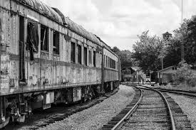 Black And White Rail Road Sign Black And White Photo Of Rusty Abandoned Trains Sitting On Railroad Tracks Black And White Photographs Railroad Tracks Abandoned Train