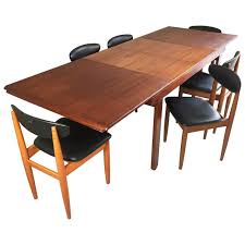 1970s Mid Century Teak Extendable Dining Table And Six Black Vinyl Chairs Dining Room Sets Antique Dining Room Sets Vinyl Chairs