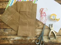 Working with the paper lengthwise, fold both sides in to the center crease that you created. How To Make A Paper Bag Book For Kids