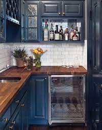 The modern farmhouse look is completed by the farmhouse basin sink and arabescus white marble countertops. Break Out The Paint Blue Kitchens Are Tres Chic Right Now Navy Kitchen Navy Cabinets Blue Kitchen Cabinets