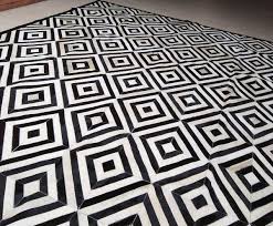 Black And White Diamond Area Rug Aladdin Just Called And Asked For Our Black And White Diamond Patchwork Cowhide Rug Design What Are You W In 2020 Patchwork Cowhide Rug Patchwork Cowhide Cow Hide Rug